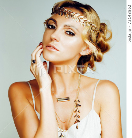 young blond woman dressed like ancient greek godess, gold jewelry close up isolated, summer trends young blond woman dressed like ancient greek godess, gold jewelry close up isolated, summer trends 72143862