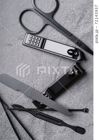 Set of manicure, pedicure tools and accessories, stone concrete background, top view close up Set of manicure, pedicure tools and accessories, stone concrete background, top view close up 72143937