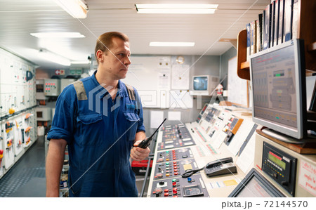 Marine Engineer working on radio communication at Engine Control room ECR 72144570