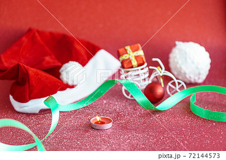Xmas, winter, new year concept - layout white plate on which there are three Christmas trees cut from sausage cheese bread with santa hat and golden candles in form of numbers 2021 Blue background 72144573