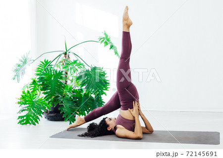 Beautiful woman yoga asana gymnastics flexibility body fitness 72145691
