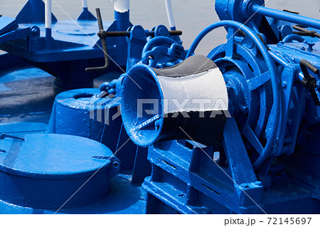 capstan and other mechanisms, painted blue, on the foredeck of the ship, close-up capstan and other mechanisms, painted blue, on the foredeck of the ship, close-up 72145697