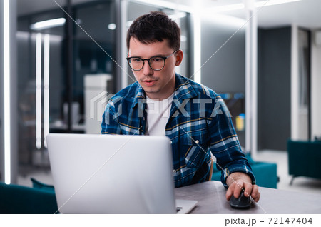 Male worker talking, making video call, chatting with friend or consulting client. Student watching webinar using laptop at home or workplace. Remote studying, new technology concept 72147404