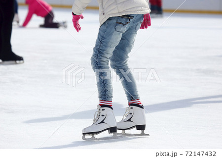 feet skating girl skating on ice rink. 72147432