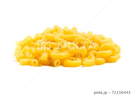Raw Italian pasta in a heap on the table isolated on white background 72150443