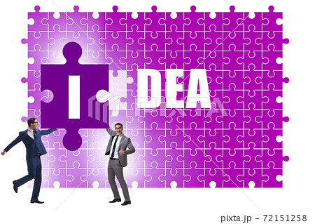 Idea concept with businessman putting jigsaw puzzle Idea concept with businessman putting jigsaw puzzle 72151258