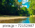 Beautiful nature landscape with flow river.Spring natural forest.Tropical travel green trees and sky background.Thailand tropical forest with lake 72152987