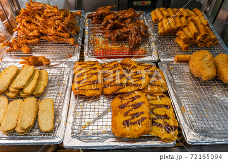Tasty fried street food and spring rolls at night market 72165094