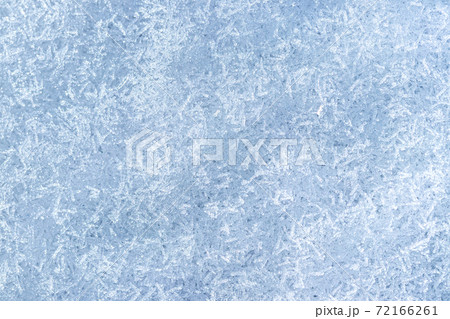 Top view of snow crystals illuminated by sunlight. Winter background. Top view of snow crystals illuminated by sunlight. Winter background. 72166261