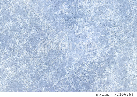Top view of snow crystals illuminated by sunlight. Winter background. Top view of snow crystals illuminated by sunlight. Winter background. 72166263