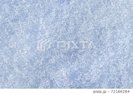 Top view of snow crystals illuminated by sunlight. Winter background. 72166264