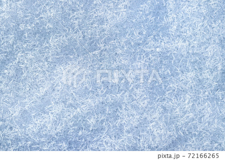 Top view of snow crystals illuminated by sunlight. Winter background. Top view of snow crystals illuminated by sunlight. Winter background. 72166265