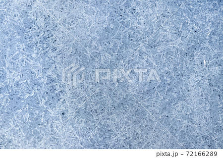 Top view of snow crystals illuminated by sunlight. Winter background. Top view of snow crystals illuminated by sunlight. Winter background. 72166289