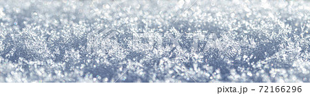 Snow crystals illuminated by sunlight. Winter background. Snow crystals illuminated by sunlight. Winter background. 72166296