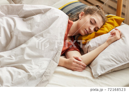 Woman sleeping in bed Woman sleeping in bed 72168523