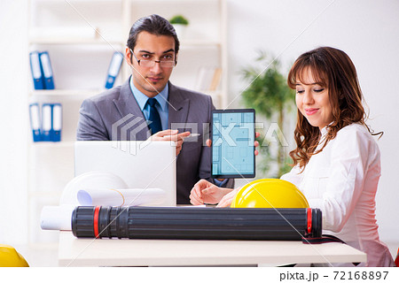 Young businessman and female architect discussing new project 72168897