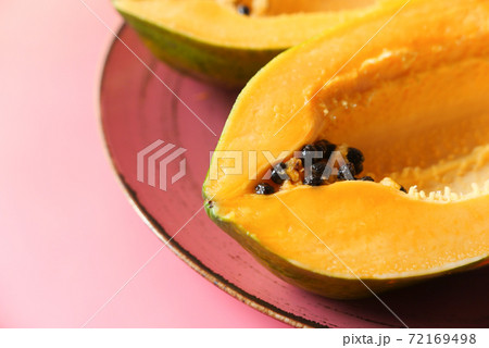 close up of slice of papaya on plate close up of slice of papaya on plate 72169498