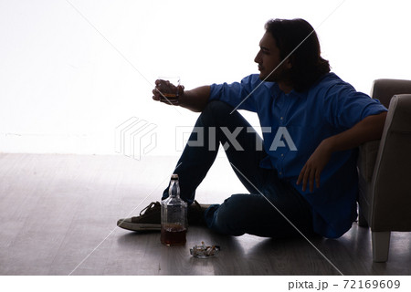 Young man suffering from alcoholism Young man suffering from alcoholism 72169609