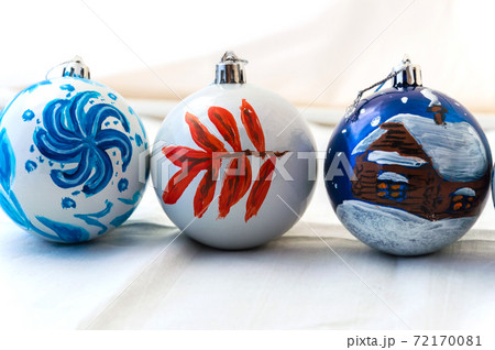 Christmas balls handmade. Three balls on light background. Decoration for the New year. Interior Christmas balls handmade. Three balls on light background. Decoration for the New year. Interior 72170081