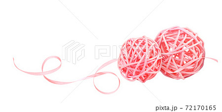 Dry pink rattan balls and twisted satin ribbon isolated on white Dry pink rattan balls and twisted satin ribbon isolated on white 72170165