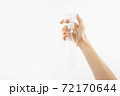 Bottle with antibacterial antiseptic gel in hand on white background 72170644