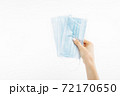 Close up of hand with mask, Surgical mask, on isolated white background, coronavirus disease 72170650