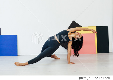Beautiful flexible woman yoga asana gymnastics body flexibility 72171726