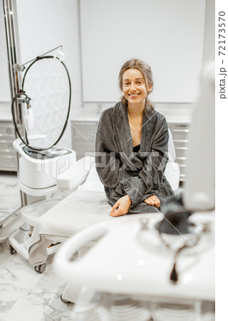 Woman at medical office after skin rejuvenation Woman at medical office after skin rejuvenation 72173570