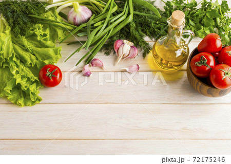 Fresh vegetables and olive oil background 72175246
