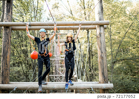 Man and woman in a rope park Man and woman in a rope park 72177052