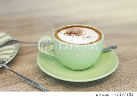 Green Cup Of Coffee Latte On Wooden Background, Close Up Of Art Coffee In Morning. 72177302