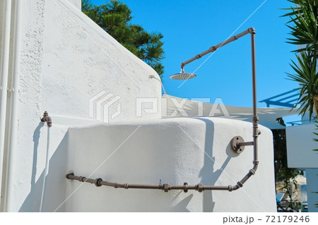 Outdoor shower, white stone shower, blue sky Outdoor shower, white stone shower, blue sky 72179246