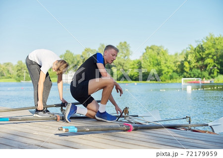 Team of two teenage boys kayaking on river Team of two teenage boys kayaking on river 72179959