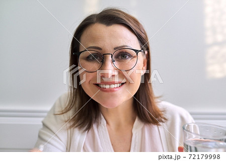 Female psychologist, psychiatrist looking at webcam, closeup face Female psychologist, psychiatrist looking at webcam, closeup face 72179998