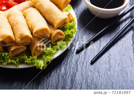 Fried spring rolls with vegetables on rustic background Fried spring rolls with vegetables on rustic background 72181997