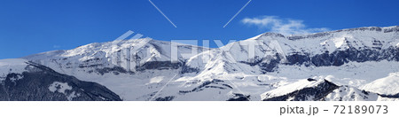 Panorama of winter snowy mountains at sunny day Panorama of winter snowy mountains at sunny day 72189073