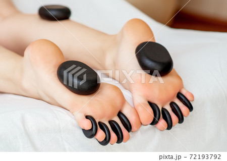 Massage stones on feet. Massage stones on feet. 72193792