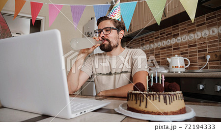Man celebrating birthday online in quarantine time. Man celebrating birthday online in quarantine time. 72194333