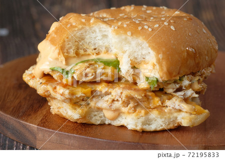 half eaten beef burger on table close up half eaten beef burger on table close up 72195833
