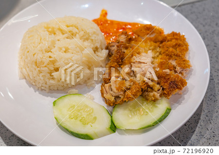 Chinese styled fried chicken meat rice served with chili sauce 72196920
