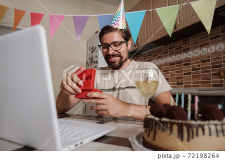 Man celebrating birthday online in quarantine time. Man celebrating birthday online in quarantine time. 72198264