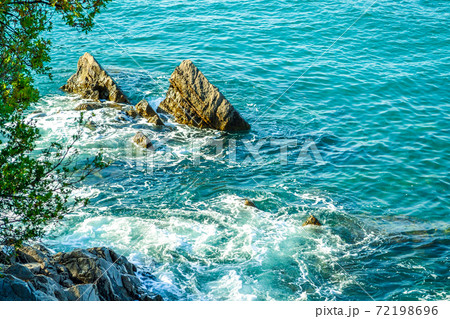 The sea view. Waves break down on large coastal stones. The sea view. Waves break down on large coastal stones. 72198696