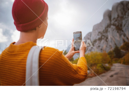 Outdoor fashion photo of young beautiful lady surrounded autumn forest in mountains 72198794