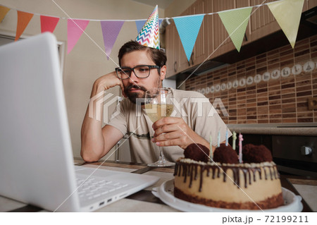 Man celebrating birthday online in quarantine time. 72199211
