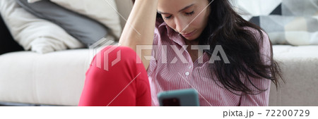 Woman sit on floor near sofa and sleep. 72200729
