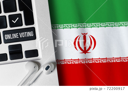 Online voting concept in Islamic Republic of Iran. Keyboard near country flag Online voting concept in Islamic Republic of Iran. Keyboard near country flag 72200917