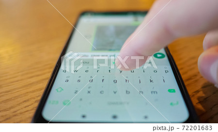 male hand typing a message on the phone male hand typing a message on the phone 72201683