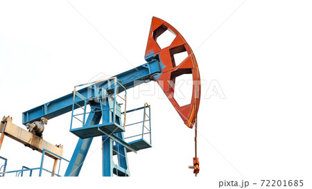 Oil pump jack rocking with pipeline in the background. Rocking machines for power generation Oil pump jack rocking with pipeline in the background. Rocking machines for power generation 72201685