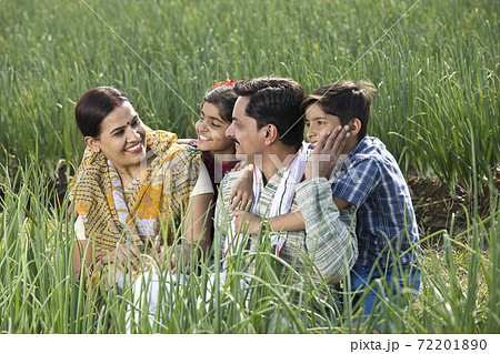 Rural family of farmer on agriculture field Rural family of farmer on agriculture field 72201890