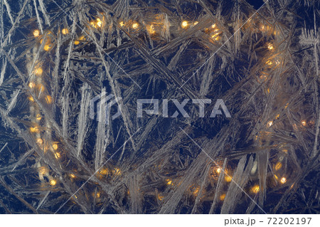 White freeze, ice crystal texture on blue background with bokeh. 72202197